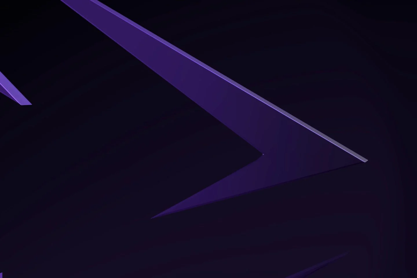 The arrowhead of the violet Innovara sculpture in low violet light